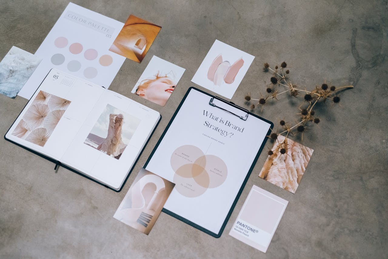 home-hero Flat lay of branding strategy materials with moodboard and color palette for creative design.